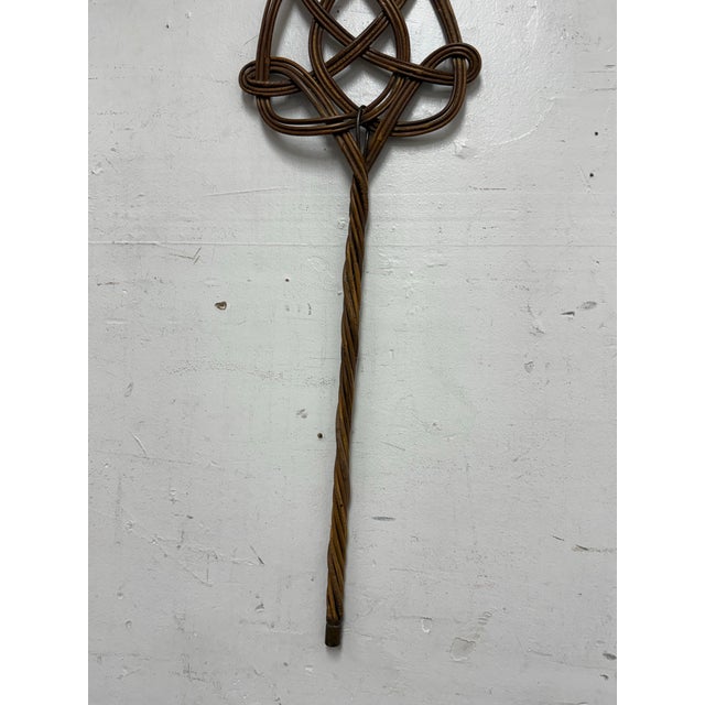 Design Plus Gallery presents a Vintage Celtic Design Rattan Rug Beater. This piece is made from sturdy yet flexible rattan...