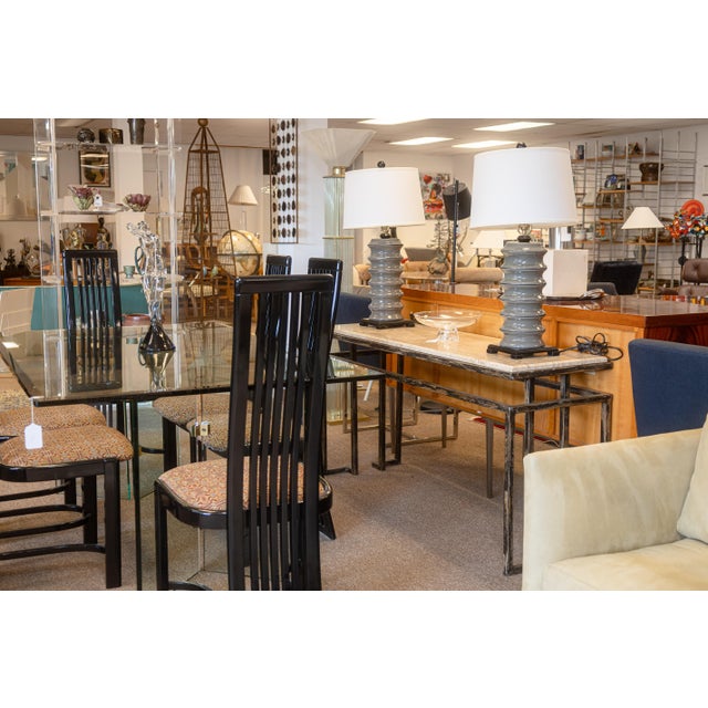 A vintage Roche Bobois console table. This chic console table features a two piece stone and metal design. The table top...