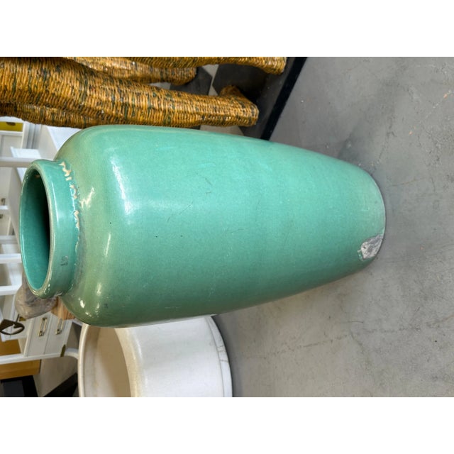 A monumental Oil Jar or large floor vase in a green glaze. It was purchased out of the estate of a long time antique...