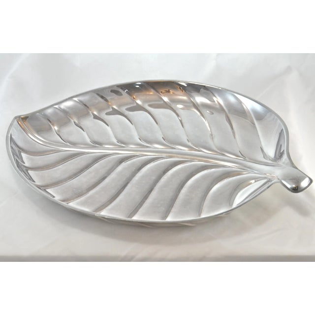 Large 15 inch vintage silver plate leaf design tray. Marked: “International Silver Company, 8199.” Light wear, scratches...