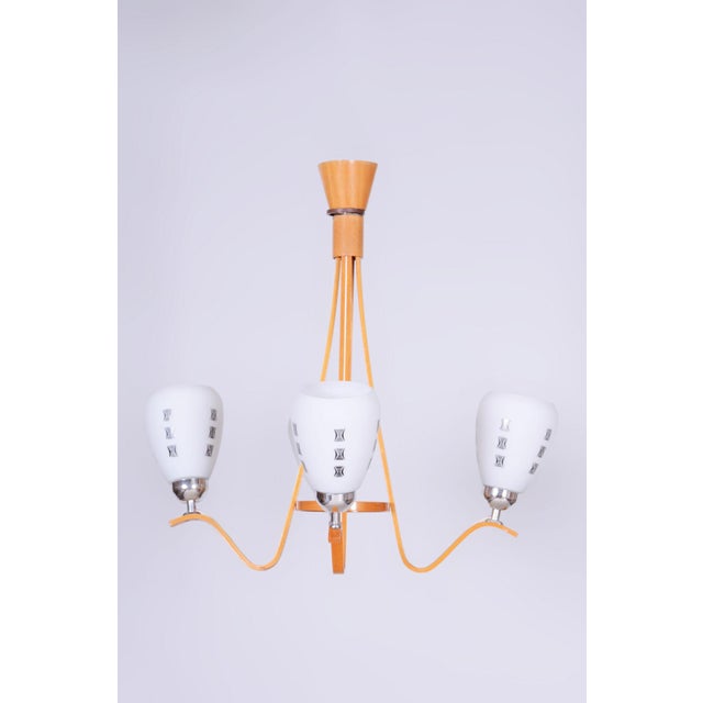 Maker: Dřevotvar Humpolec This stylish and highly elegant four-arm chandelier, originating from the 1960s from...