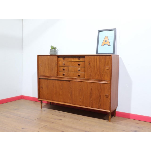 Discover a gorgeous Danish tall credenza at Mid Century Traders, where timeless design meets functional elegance. This...