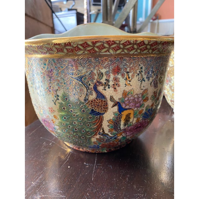 Wall Pockets with Colorful Peacocks along with wonderful detail work on a ceramic glaze. Sure to add that wonderful Asian...