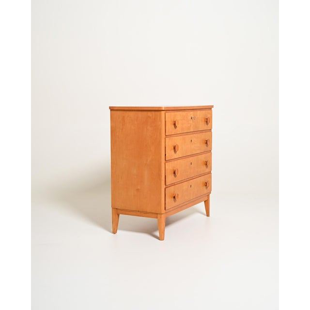 Birch frame with four drawers and turned wooden knobs. Tapered legs. Scandinavian production from the 1950s. Made in...