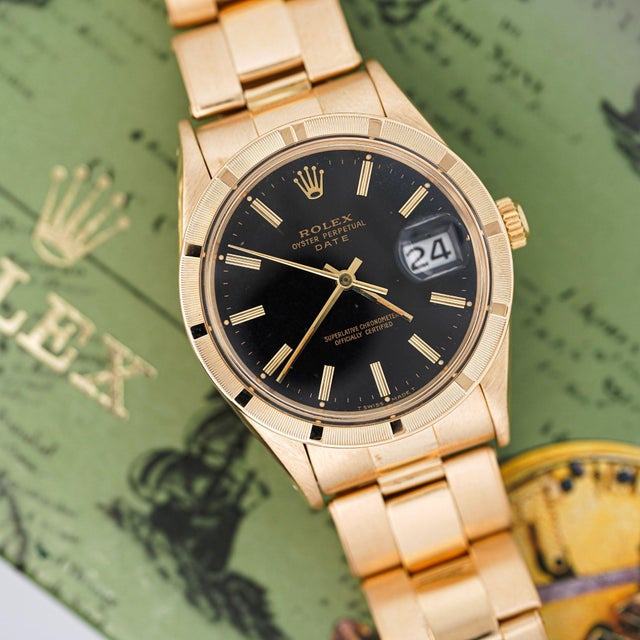 Rolex Oyster Perpetual Date featuring rare petroleum black gloss dial in 34mm 18K yellow gold case with engine-turned...