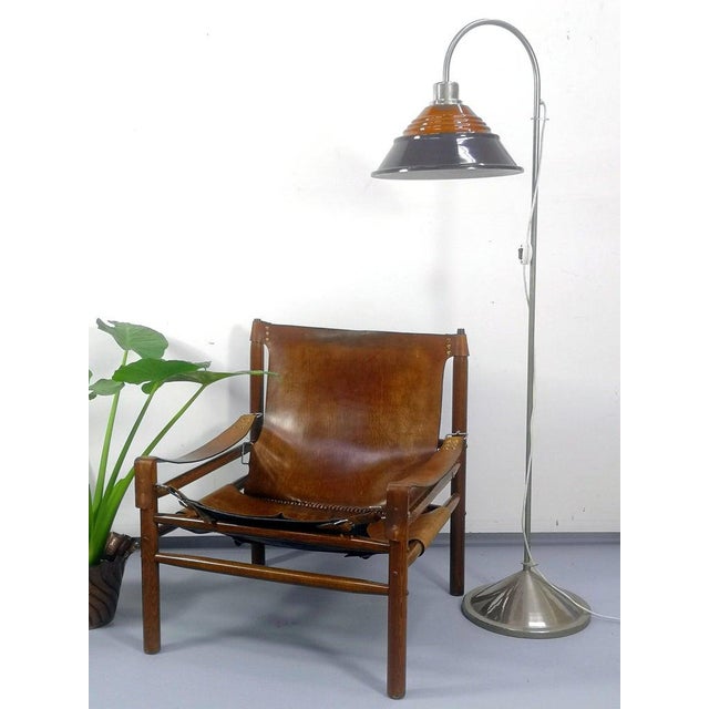Bent neck, glass shade, chrome frame floor lamp, in perfect working condition from the 1970s. Dimensions: 162x60x60cm...