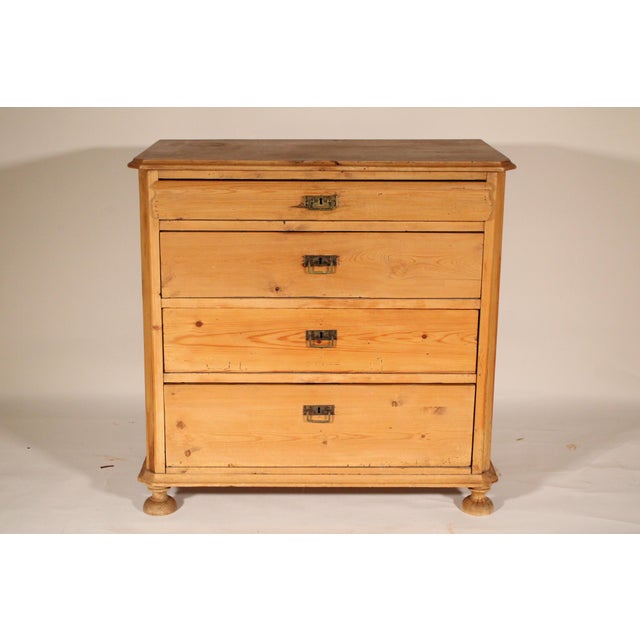 Country pine chest of drawers, circa 1900. With a 3 board pine top with canted corners and molded front and side edges, 4...