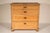 Country pine chest of drawers, circa 1900. With a 3 board pine top with canted corners and molded front and side edges, 4...