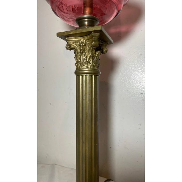 Antique Ornate Gilt Bronze Cranberry Cut Glass Electrified Oil Pillar Table Lamp For Sale - Image 4 of 12