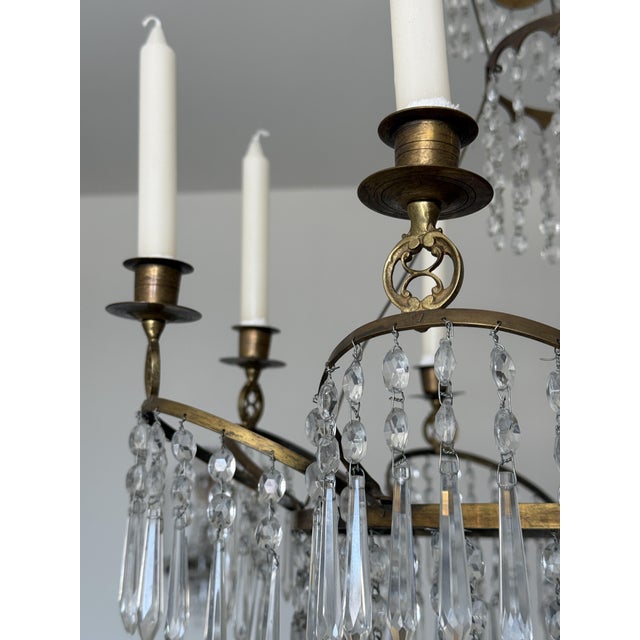 It is a simple candle chandelier. Up to 250V (Europe/UK Standard).The wiring of this item may be original and might need...