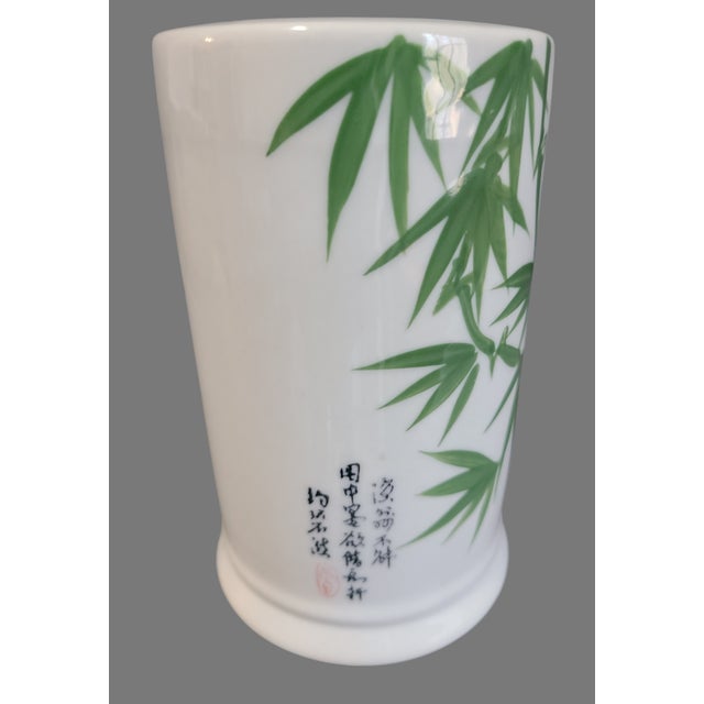 Enhance your space with the Vintage Panda Garden Bamboo Motif Tube Vase, a ceramic piece that blends contemporary style...