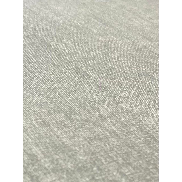 An exceptionally sleek linen-wrapped wood dining table or desk designed by Arizona artist Ernst Gruler for Studio A.