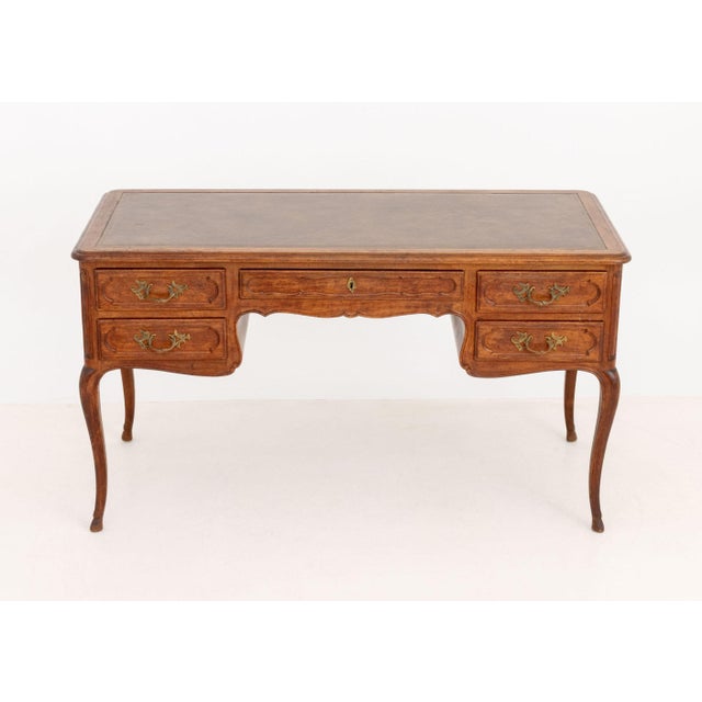 Louis XV Style Walnut Writing Desk, with tan leather inset top above one central drawer flanked by two drawers on each...