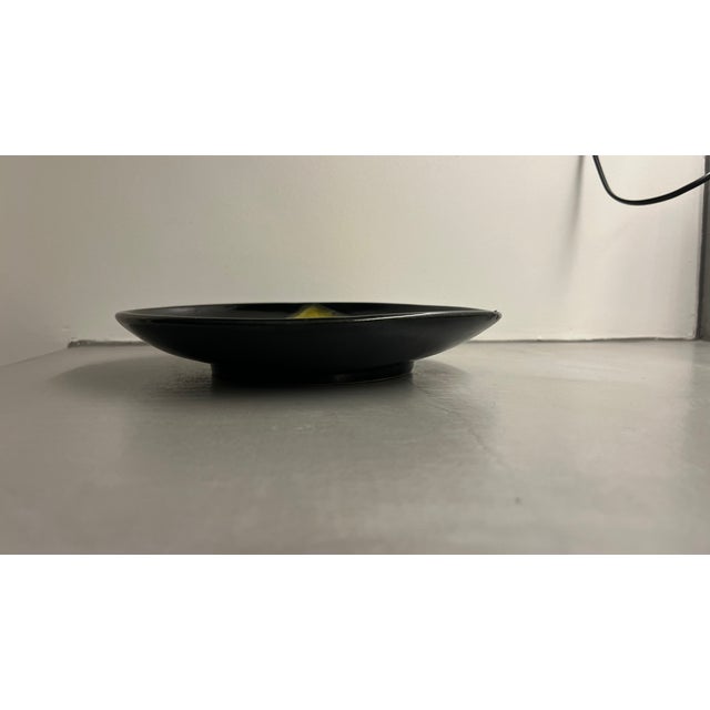 Excellent condition Plate, model 864, reference number in Pol Chambost's catalogue raisonné Yellow and black glazed...