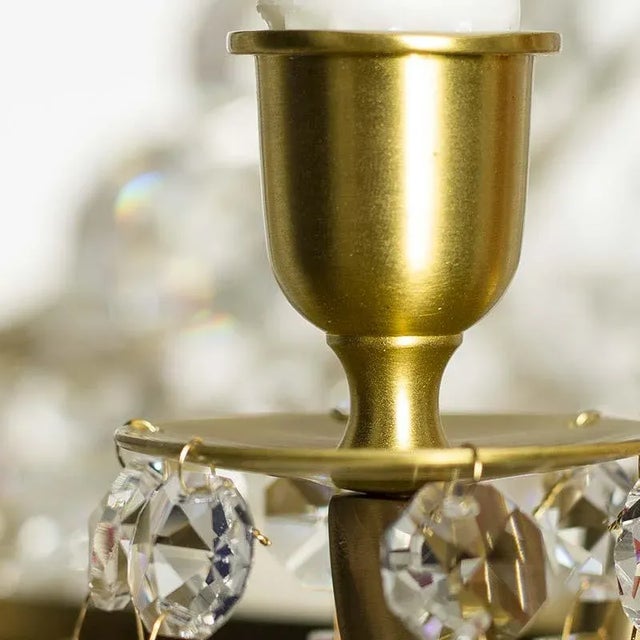 An elegant and classic empire in the series Nobel. Eight holders for candels and 9 light bulb holders on the inside frame....