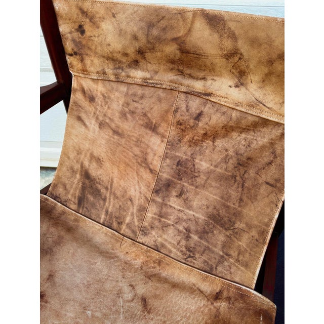 An absolutely stunning pair of 1960s slingback safari chairs by Michel Arnoult. Featuring beautifully restored Brazilian...