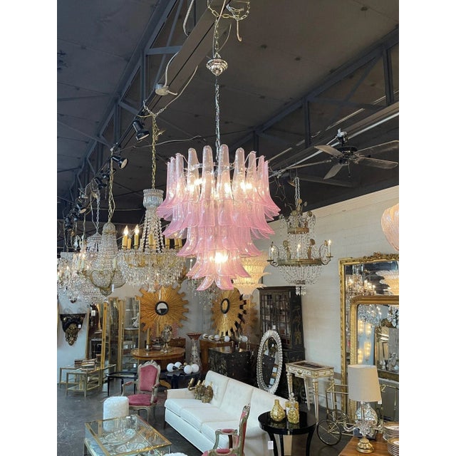 Stylish modern pink Murano glass saddle form chandelier. Beautiful scale and shape and lovely glistening glass. Gorgeous!!
