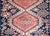 An exciting early 20th century Persian Shrivan rug with three large central diamond medallions with myriad stylized floral...