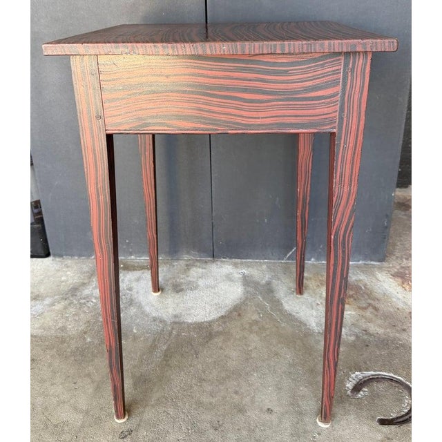 This fine 20thc original paint decorated taper leg one drawer stand has a birds eye maple drawer.The draw under the bottom...