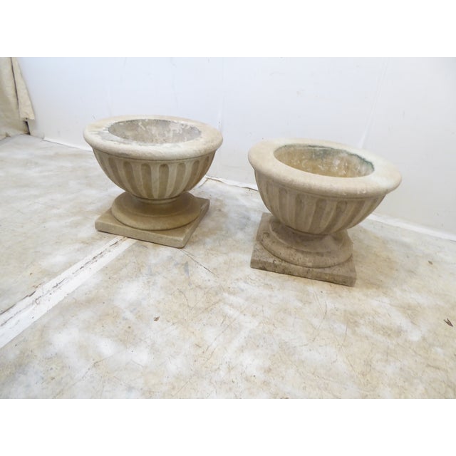 This pair of limestone planters measure 12"H x 16"Diameter.