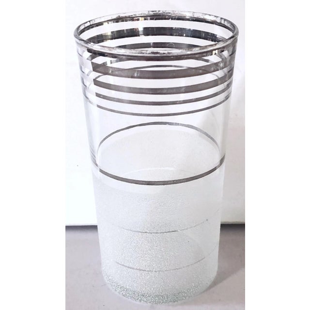 Mid-Century glasses have a great contemporary look. Set of 4. Bottom half is textured with a triple stripe of frosted and...