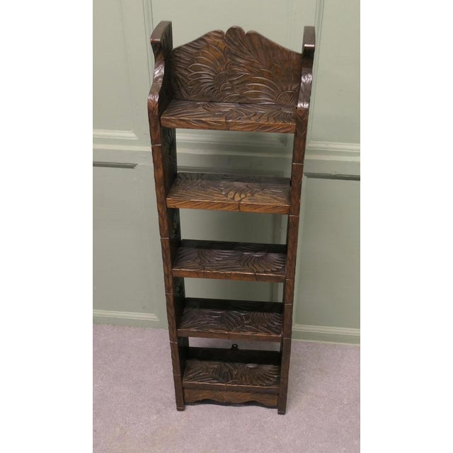 Japanese Liberty Arts and Crafts Tall Bookcase Carved with Sunflowers This Rare bookcase is carved with the sunflower...