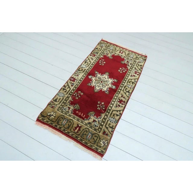 This beautiful, traditional vintage, handknotted Turkish rug is approximately 60 years old. It is handmade of very fine...