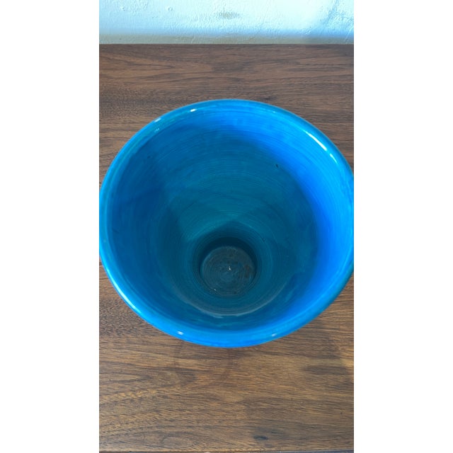 Italian mid-Century modern footed vase designed by Aldo Londi for Bitossi/Rimini Blu. Each side features a different...