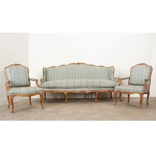 Dimensions: 40” H x 81” W x 25 ¼” D An early 19th century French Louis XV style giltwood 3-piece parlor salon suite. This...