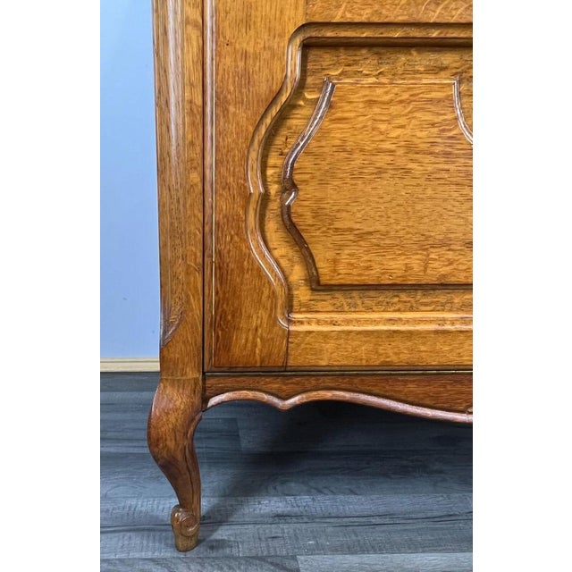 The sideboard /chest of drawers has one door , is decorated with wonderful carvings, it rests on beautiful legs....
