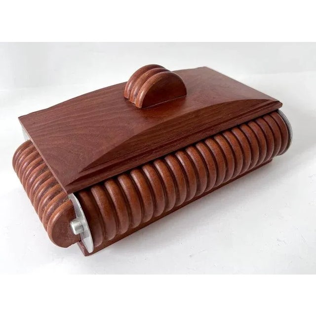 Acquired in Paris France, a very unique and well made box. The rounded ribbed sides and pull on the lid are very well...