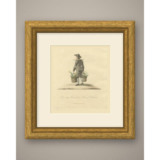 An original antique hand colored engraving after miss semple, lettered "boy selling flowers in the streets of rotterdam.",...