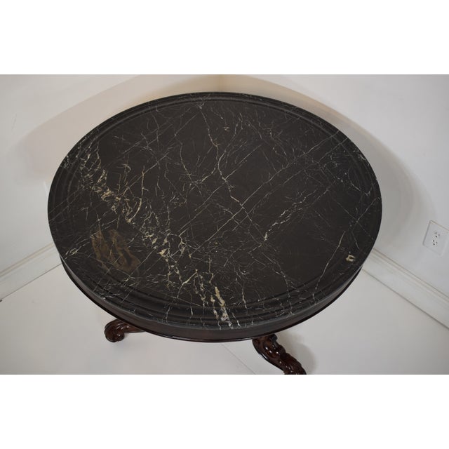 Early 1800's French Mahogany Gueridon with the original marble top with nicely shaped edge and beautifully carved legs and...