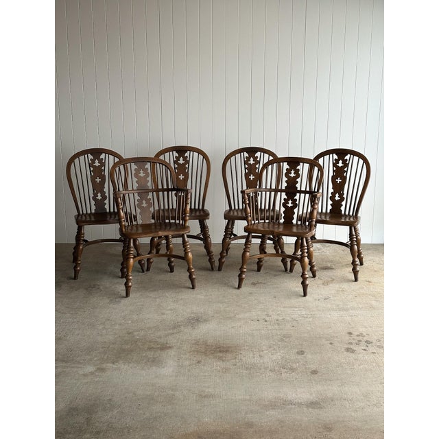 Complete dining suite by Conant Ball Furniture Makers, including two captain’s armchairs and four side chairs. Constructed...