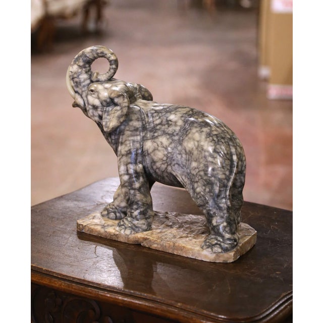 Carved in France in the late 19th century, this substantial elephant sculpture is crafted from richly variegated marble...
