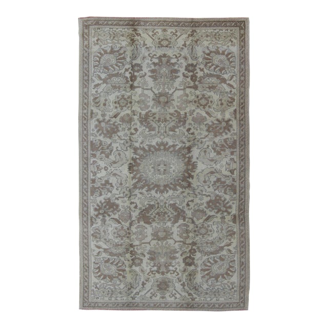 Muted Turkish Oushak Rug Featuring Soft Taupe, Faded Sage, and Pale Gray For Sale
