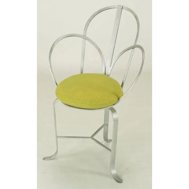Wrought iron framed architecturally inspired chair with arched three part back and sides constructed of incised flat...