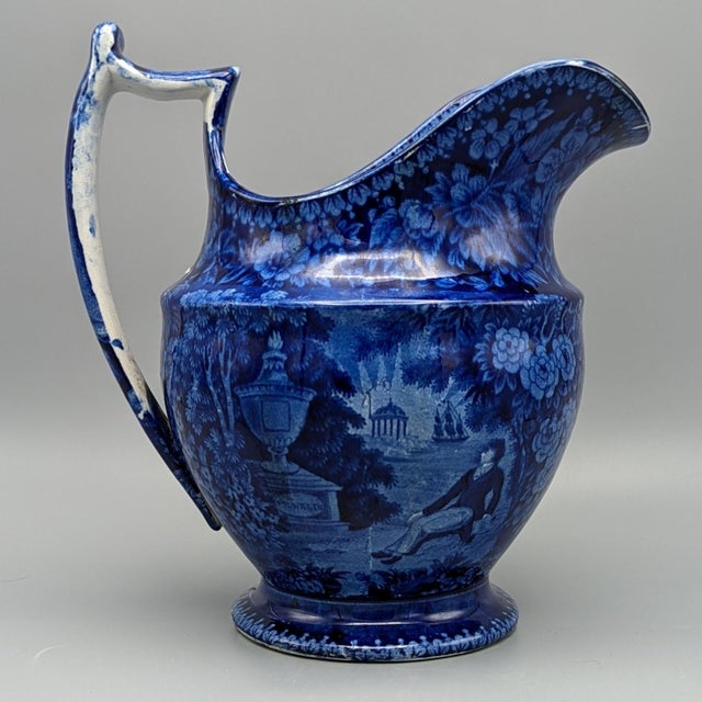 Decorative and historical. Staffordshire transferware Pitcher by Enoch Woods, circa 1825. The central scene on each side...