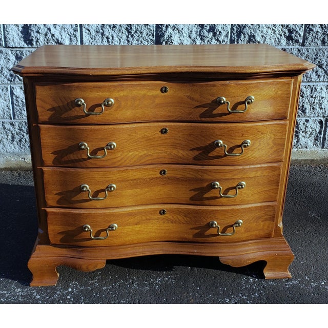 Kincaid Chippendale Oak Bedside Chest or Nightstand. Measures 24" in width, 16" in depth and stands 23" tall.