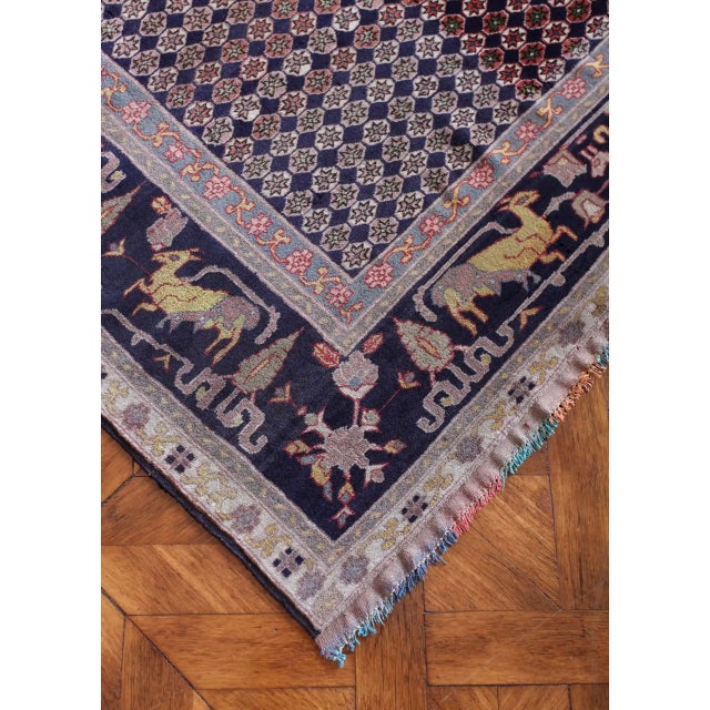 Hand-knotted oriental rug with a beautiful tree of life motif and a rich border with animals. The rug has a high density...