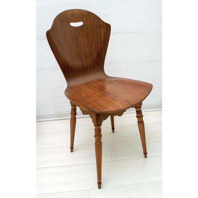 Four original curved plywood teak, beech chairs, Italian design of mid-century style Carlo Ratti. This piece is attributed...