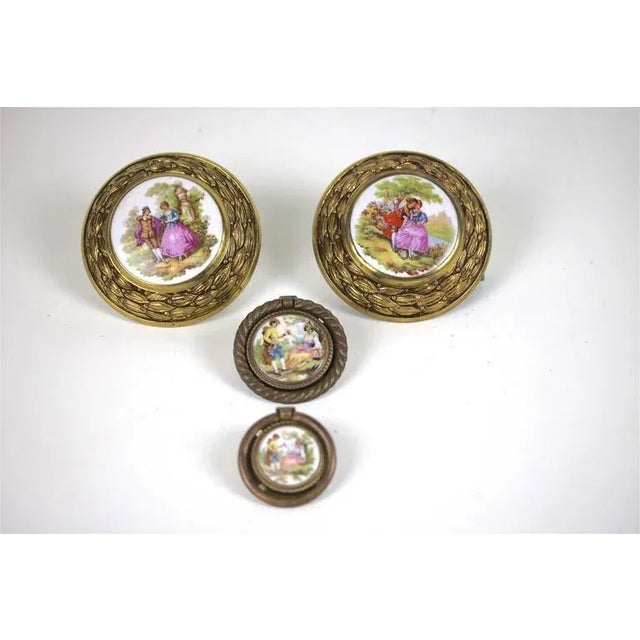 A beautiful large pair of French Fragonard signed porcelains in a highly decorative aged brass frame can be used for a...