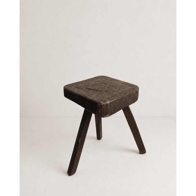 This charming vintage three-legged stool captures the honest beauty of traditional rustic craftsmanship. Carved from solid...