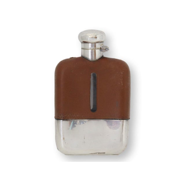 1930s leather-wrapped flask commissioned for the R.M.M.V. Winchester Castle. Built in Belfast in 1930, the ship initially...