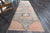 Vintage Hand-Knotted Runner rug is a semi-antique vintage runner rug. The '70s Eastern region of Anatolia's unique rug is...