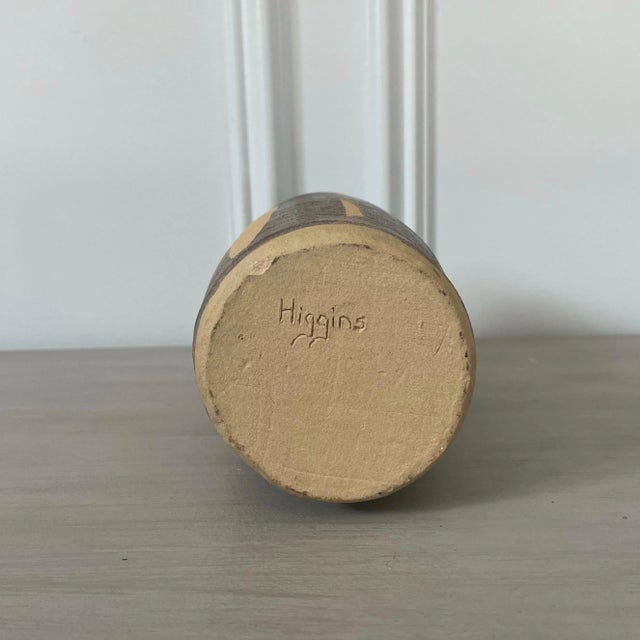 Very chic medium-sized shabby vase, featuring matte brown colors & design. A gorgeous neutral that looks nice as a vessel...