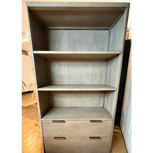 Beautiful bookcase in like new condition. Sturdy and well-made with both drawers and shelves for storage, toys and books....
