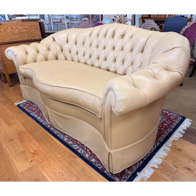 A classic Century Furniture Chesterfield sofa upholstered in warm creamy butterscotch leather. Deep diamond tufting,...