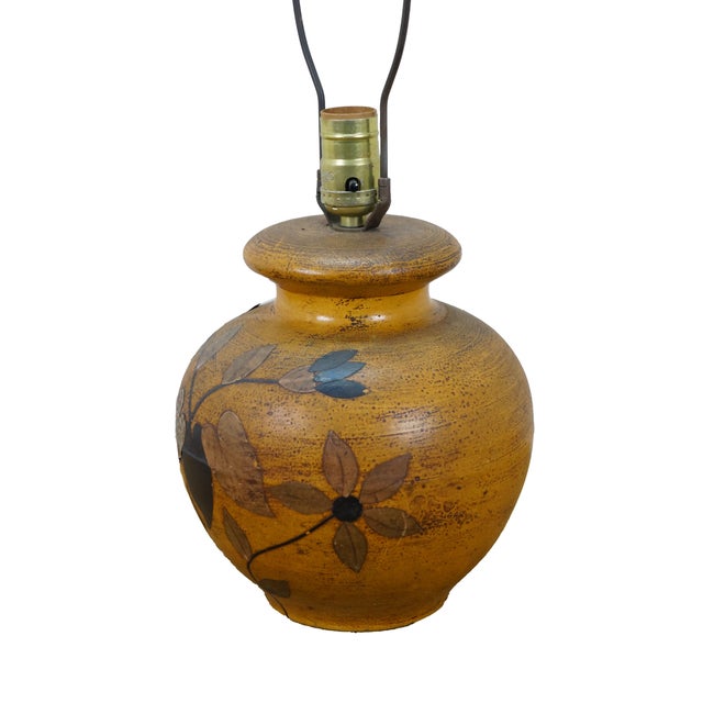 Mid to late 20th century ceramic table lamp in the shape of a round orange pot / urn, etched and decopaged in brown,...