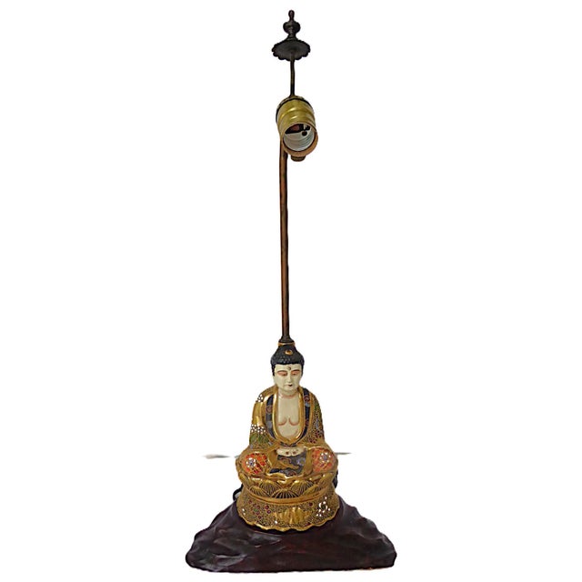Finely detailed Satsuma table lamp of Buddha, 1950s Japan, on a richly decorated throne seating in a lotus position with...